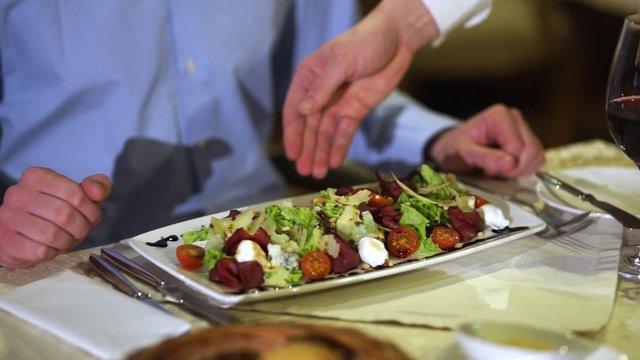 The waiter delivers the salad-2