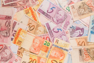Fototapeta na wymiar Brazilian money. A lot of real notes.