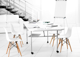 White table and chairs in office interior