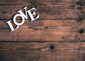 Word ''love'' on a old wood planks. St. Valentine's Day