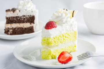 Close up Japanese Matcha Green tea cake decorated with strawberr