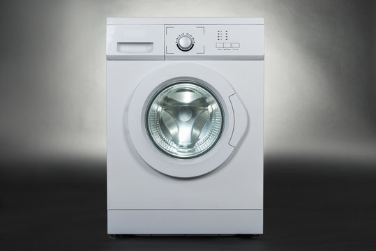 Washing Machine Over Gray Background