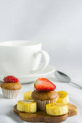 Delicious banana cake decorated with strawberry, berry sweet.