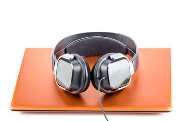 modern laptop with stereo headset