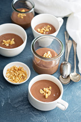 Obraz na płótnie Canvas Chocolate yogurt dessert with salted peanuts