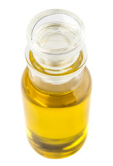 Olive oil in a glass bottle over white background