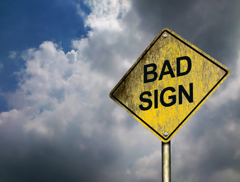  Bad Sign Road Sign with threatening darkening clouds in the sky background (Copyspace)