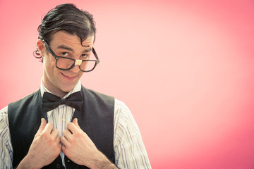 Happy nerd man with glasses think portrait on pink - obrazy, fototapety, plakaty