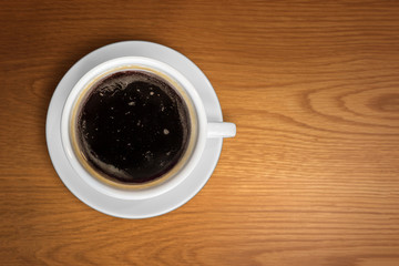Top view black coffee on wooden table, Low key
