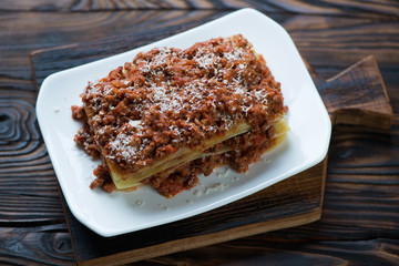 High angle view of lasagna bolognese, studio shot, closeup