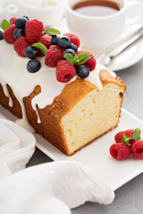 Yogurt pound cake with glaze and fresh berries