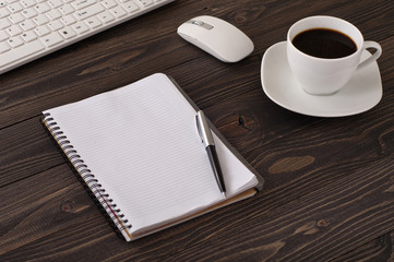 notebook with blank pages and a cup of black coffee