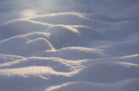 The snow fall. An image of a snow falling against a sunlight. Image has a vintage effect applied.