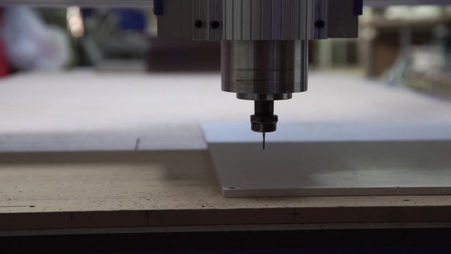 Milling cutting machine makes a plotter cutting in plastic