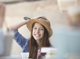 teenage student with a hand on his head