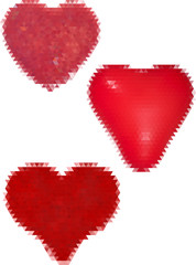 three red hearts from triangles isolated on white