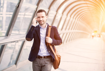 Young attractive business man in business district