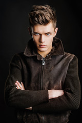A young man model on dark background 