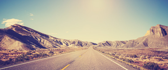 Vintage toned panoramic photo of desert road, Utah, USA © MaciejBledowski