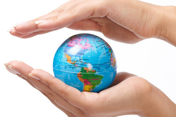 woman's hand with globe