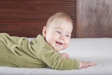 Fototapeta premium baby green onesie smiling