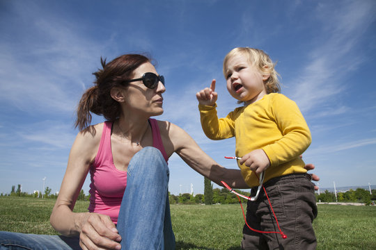 Mom And Baby Talking In Park