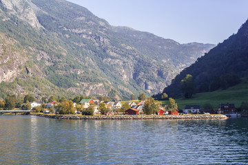 Fototapeta na wymiar Landscape with houses in mountains at Norway fjord