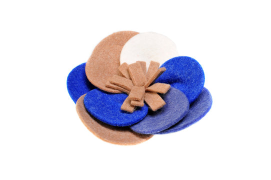 Brooch made of felt wool on a white background