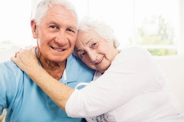 Cute senior couple hugging 