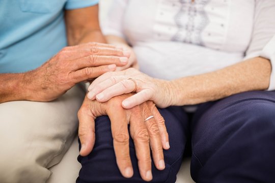 Cute Senior Couple Holding Hands