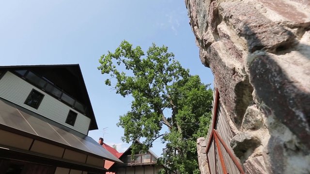 Big mansion and gates in countryside. Summer. Pan horizontal.