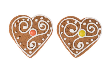 Two Christmas gingerbread hearts isolated on a white background