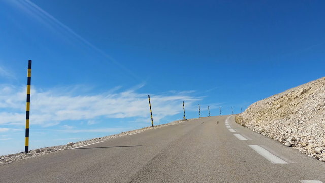 Vehicle point of view shot while driving on the road climbing the South face of the famous Mont Ventoux located in Provence in South of France.