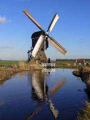 Dutch windmill reflected in water, Streefkerk, South Holland, Netherlands