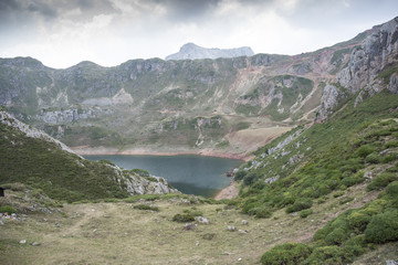 Fototapeta na wymiar Views of Lago de la Cueva (Lake of the Cave) in Saliencia Valley, Somiedo Nature Reserve. It is located in the central area of the Cantabrian Mountains, Asturias, Spain