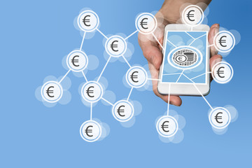 Mobile e-payment and e-commerce concept with hand holding modern smartphone in front of neutral...