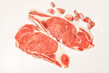 Raw steaks isolated