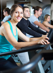 Fototapeta na wymiar Adults training on treadmills