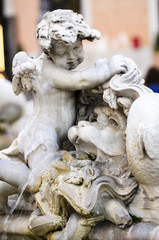Detail of cherub in the Fountain of Neptune, Piazza Navona in Ro