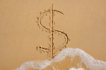 Dollar sign in beach sand being washed away