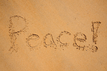 Peace, written on a sandy beach.