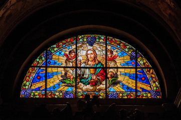 Detail of a stained glass window in old church in Chioggia