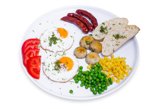 Full breakfast with scrambled eggs and sausages, isolated with clipping path