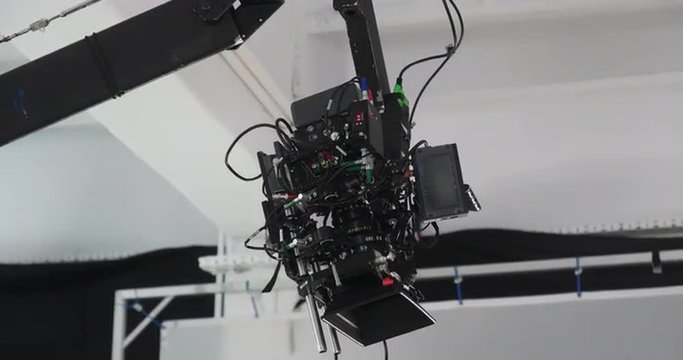 Tight shot of professional production camera mounted on a jib moving upwards 4K Prores HQ