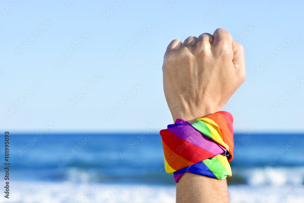 Sticker man with a rainbow flag painted in his wrist