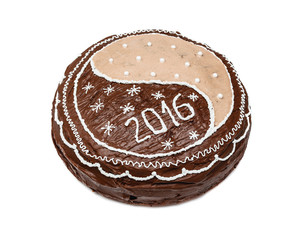 Homemade chocolate cake, pie decorated with chocolate, white glaze, sugar beads and figures 2016, isolated on the white