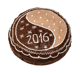 Homemade chocolate cake, pie decorated with chocolate, white glaze, sugar beads and figures 2016, isolated on the white