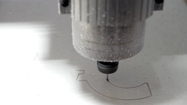 Milling cutting machine makes a plotter cutting in plastic currency EURO signs