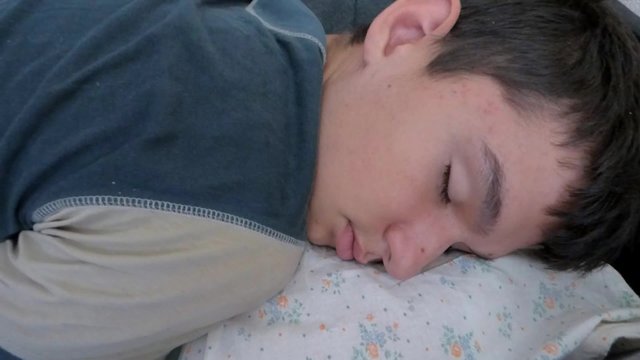 The young man peacefully sleeping