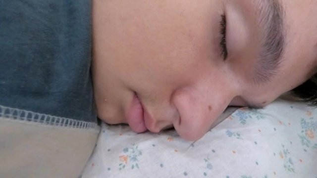The young man peacefully sleeping